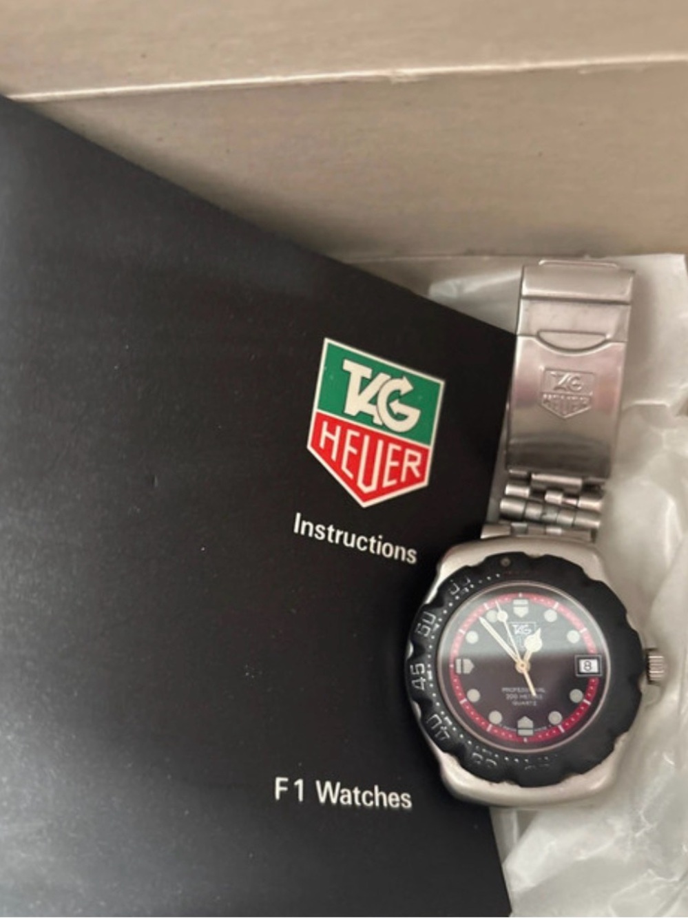 Tag Heuer Men's Stainless Steel Watch with Black Dial and Red Accents